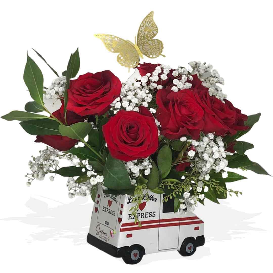 Mail truck white ceramic vase with a dozen of roses, baby's breath and golden butterflies flower arrangement.  Flower delivery Salem Oregon