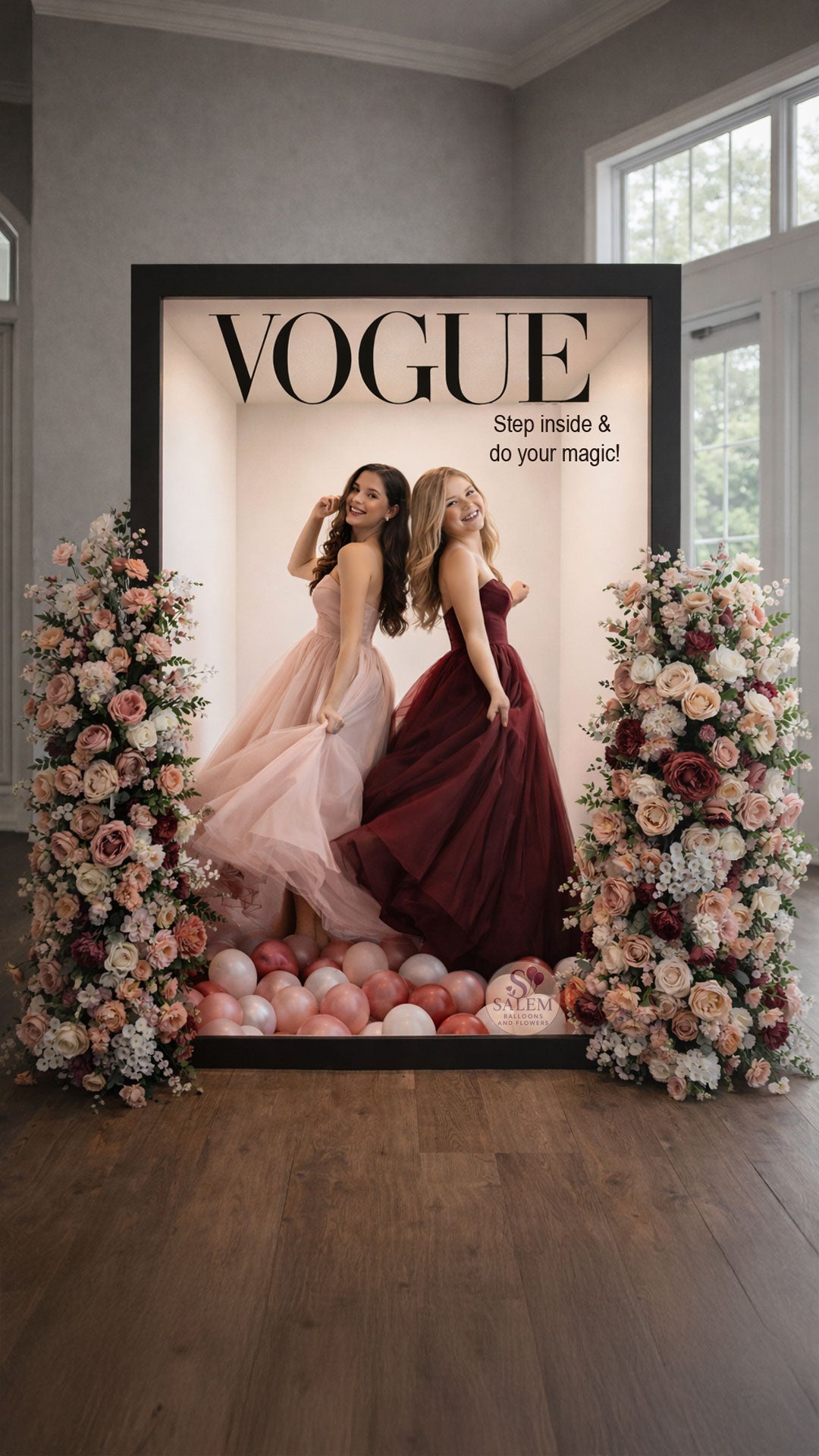 Vogue magazine cover photo booth with two young girls wearing prom dresses, surrounded by flowers and decor. Party Rentals. Oregon.