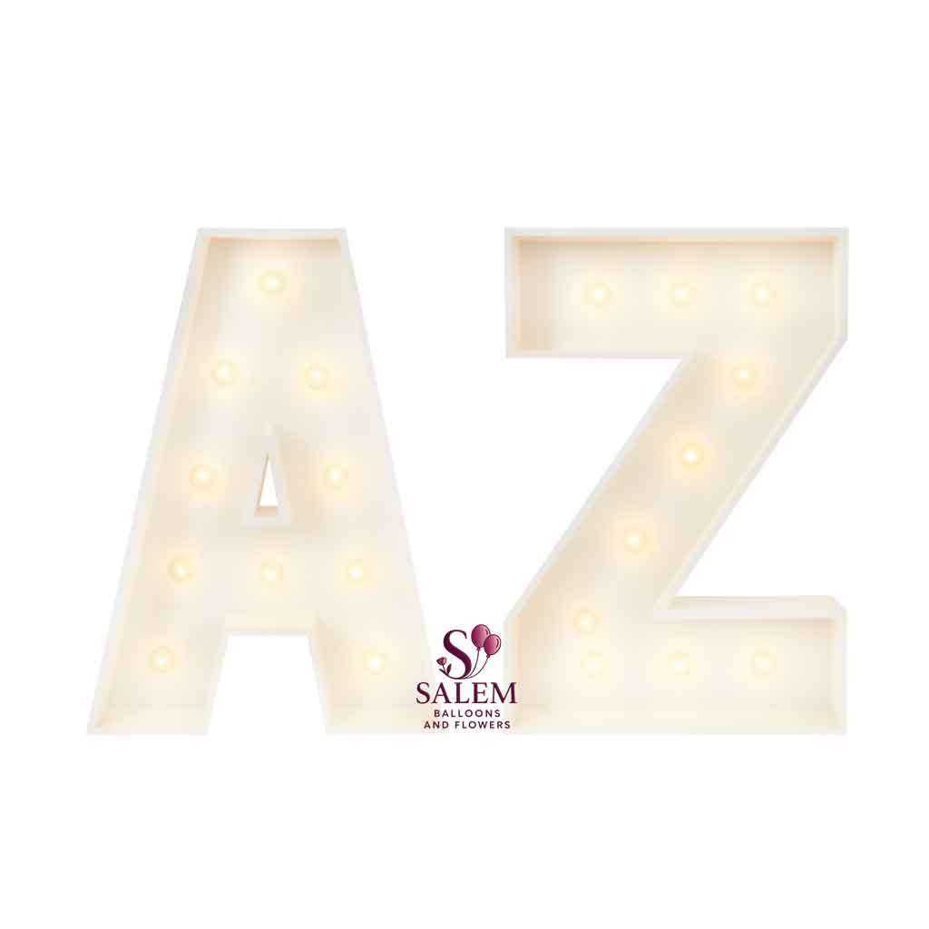 3 ft tall white wooden Marquee letters 'A' and 'Z' with lit bulbs on a white background. Marquee letter Rentals. Oregon.