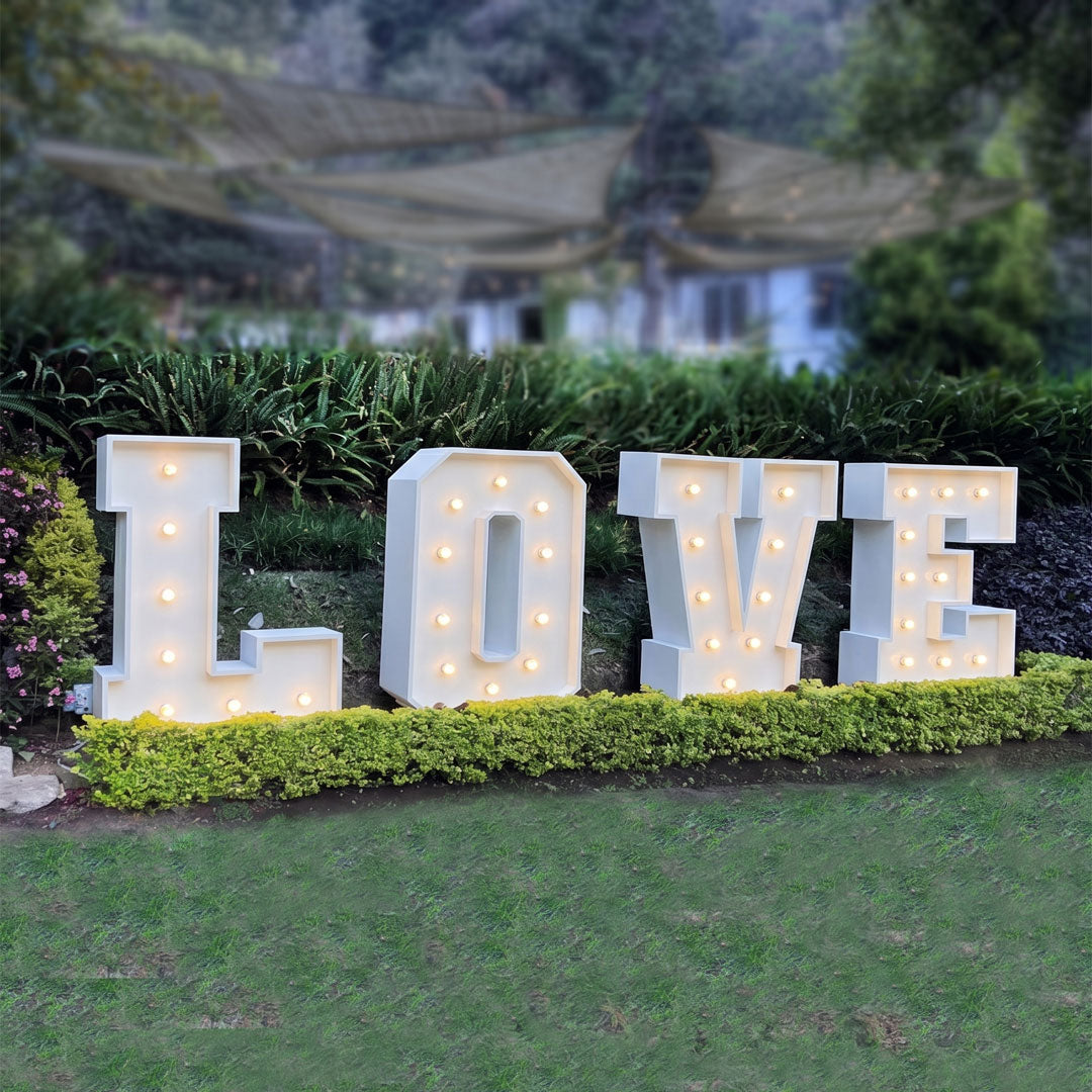Marquee Letter display spelling LOVE in a landscaped backyard. Oregon
