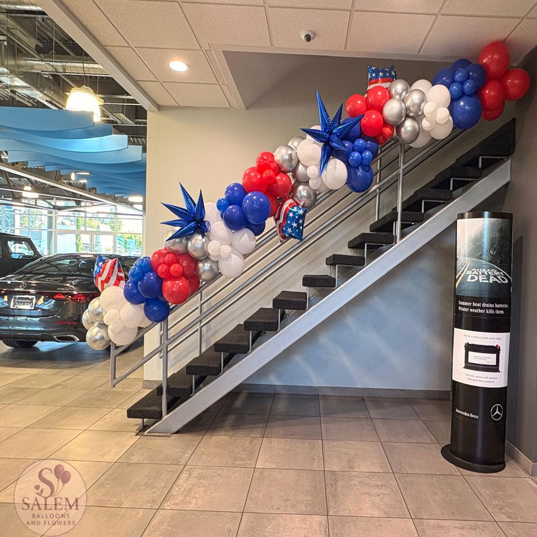 Patriotic balloon garland for the waiting room of Mercedes Benz of Salem by Salem Balloons and Flowers.