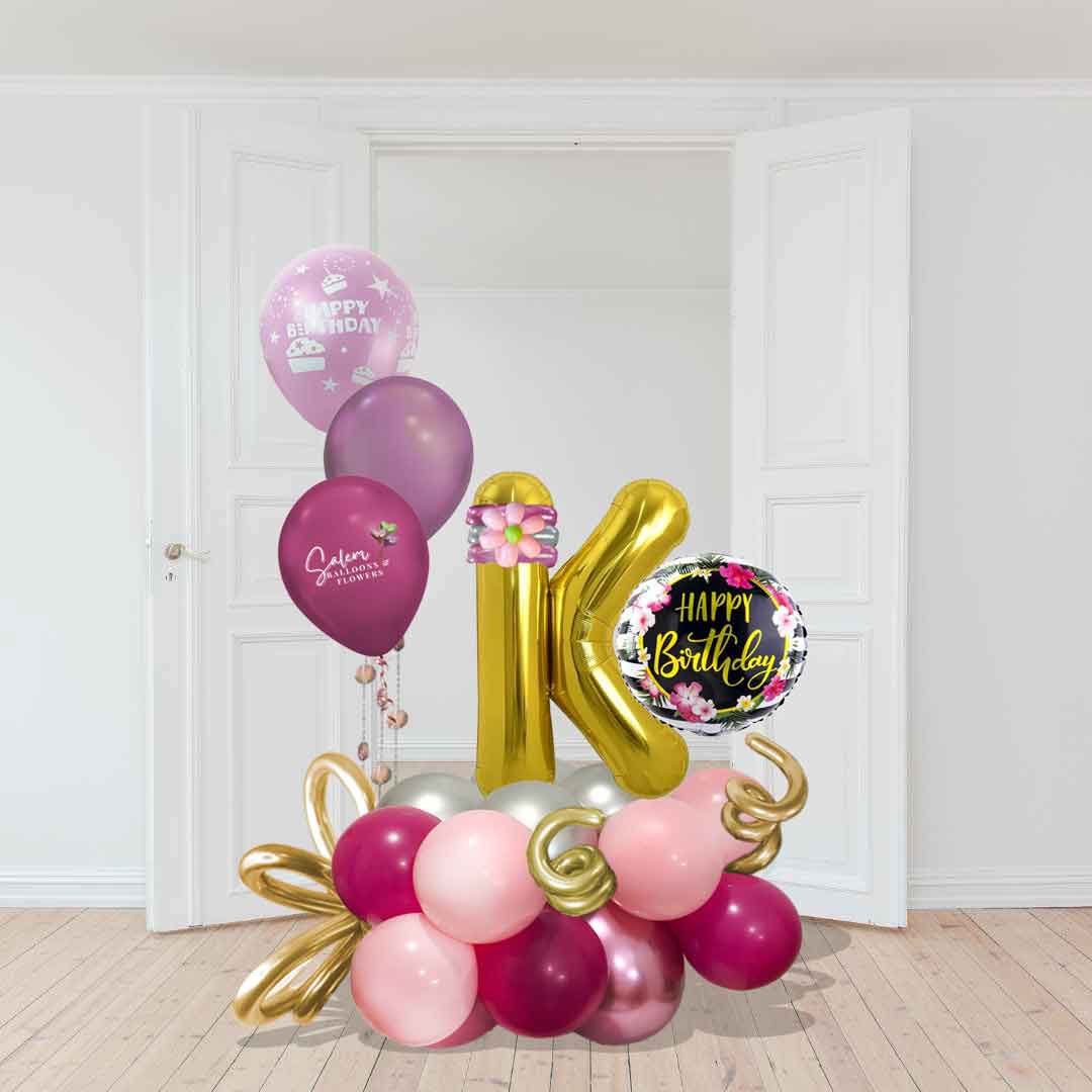 Balloon letter with a happy birthday balloon in a balloon base decorated with ribbon and curly balloons and a set of helium balloons. Balloons Salem Oregon and nearby cities. On site Size chart.