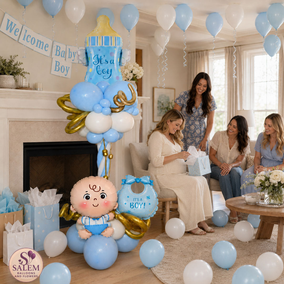 A baby shower celebration in a living room decorated with blue and white balloons, a baby shower balloon tower, a baby silhouette balloon, and gift bags. Three women are gathered near the center, and a 'Welcome Baby Boy' banner hangs on the fireplace. and a Salem Balloons and Flowers logo on the bottom left corner.