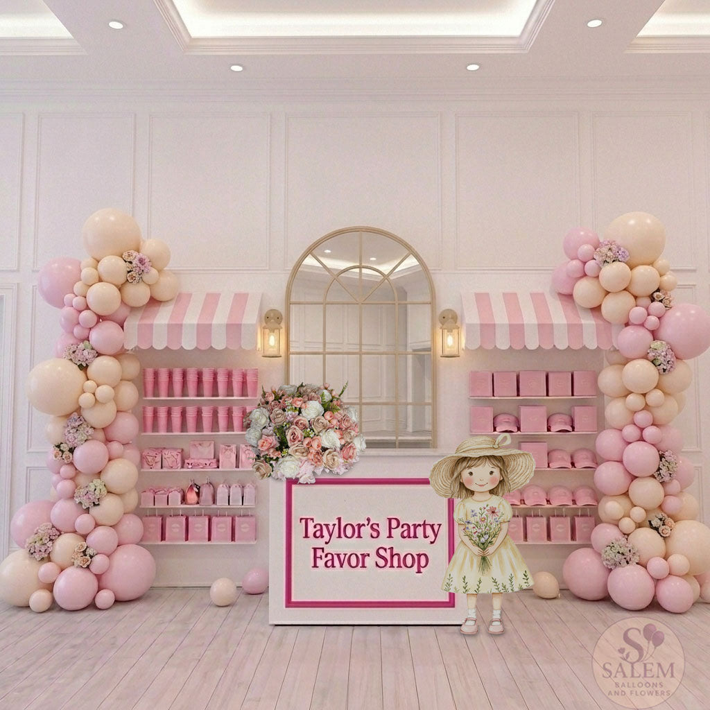 Decorative setup with a party favor gift shop design decorated with pink balloon garlands, flowers, and a personalized sign for 'Taylor's Party Favor Shop' in a stylish interior. Birthday balloon decor. Oregon.
