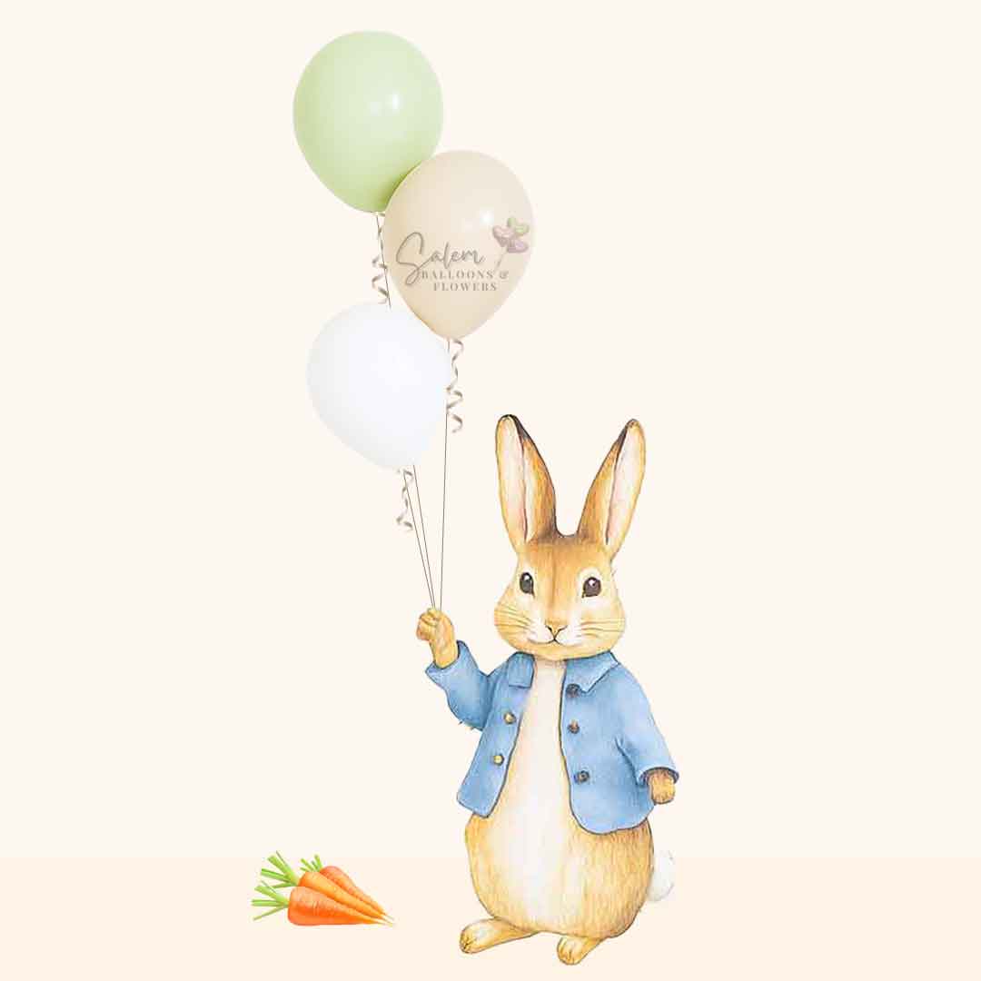 Cutout of a rabbit holding balloons with a carrot on a white background. Balloon Decor Oregon.