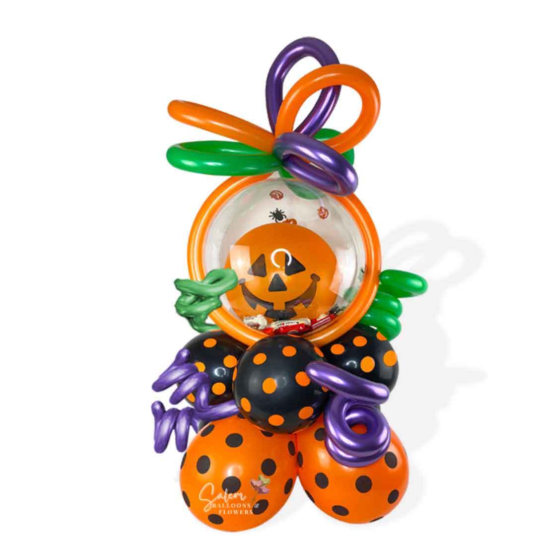 Pumpkin head stuffed bubble balloon. Filled with halloween candy and decorated with curly balloons. Oregon balloon delivery.