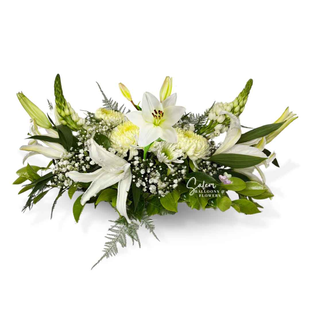 White flower arrangement, featuring white lilies, moms and dragon flowers. Salem Oregon Flower delivery.