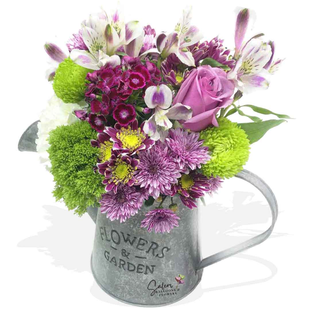 fresh flower arrangement in a decorative Flower can. Salem Oregon flower delivery