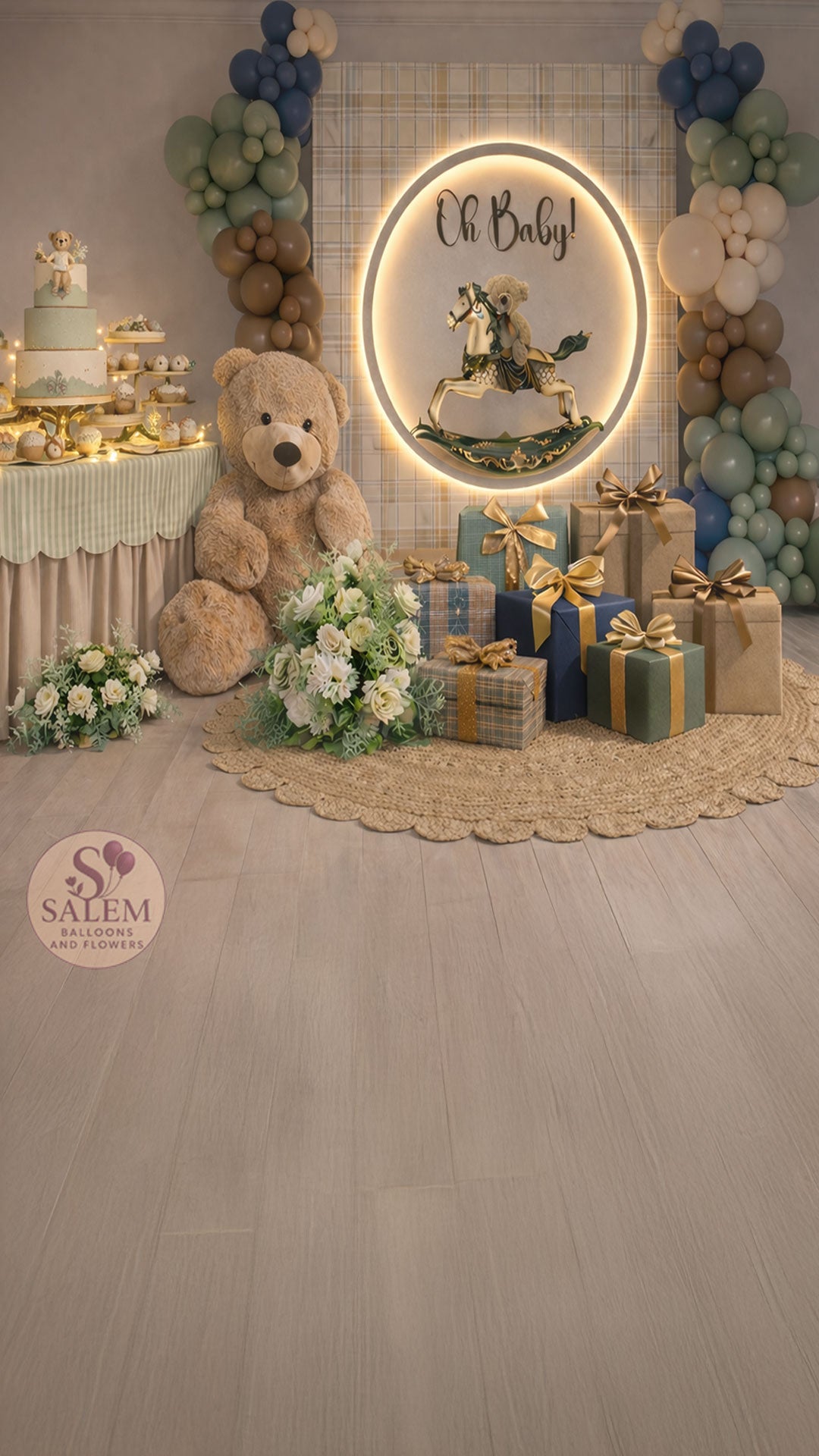 Baby shower setup with a Rocking horse and teddy bear theme, with balloon garlands, gift boxes, and a decorated cake table with twinkling lights and flowers. Balloon decor. Oregon.