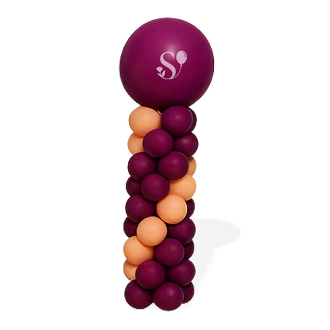 Round top balloon column in a grape purple, and peach colors on a white background. Oregon Balloon decor.
