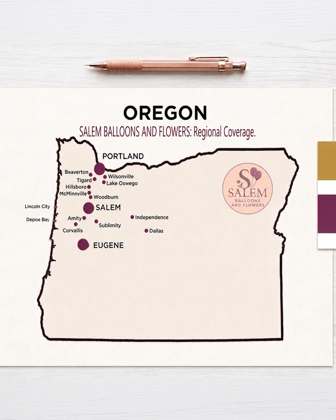 A professional service area map for Salem Balloons and Flowers, an Oregon event design studio. The minimalist map features a deep plum border and highlights primary service hubs in Salem, Portland, and Eugene with large branded markers. Surrounding cities including Lake Oswego, Beaverton,Lincoln City, Depoe Bay,  and Corvallis are noted with smaller markers, displayed on a bright, editorial-style designer's desk with rose gold drafting tools.