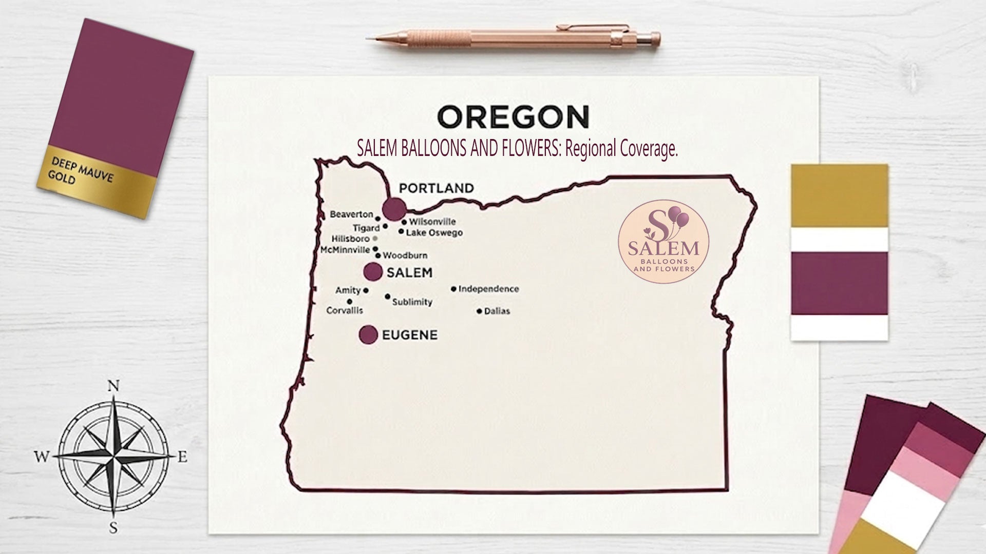 A professional service area map for Salem Balloons and Flowers, an Oregon event design studio. The minimalist map features a deep plum border and highlights primary service hubs in Salem, Portland, and Eugene with large branded markers. Surrounding cities including Lake Oswego, Beaverton, and Corvallis are noted with smaller markers, displayed on a bright, editorial-style designer's desk with rose gold drafting tools.
