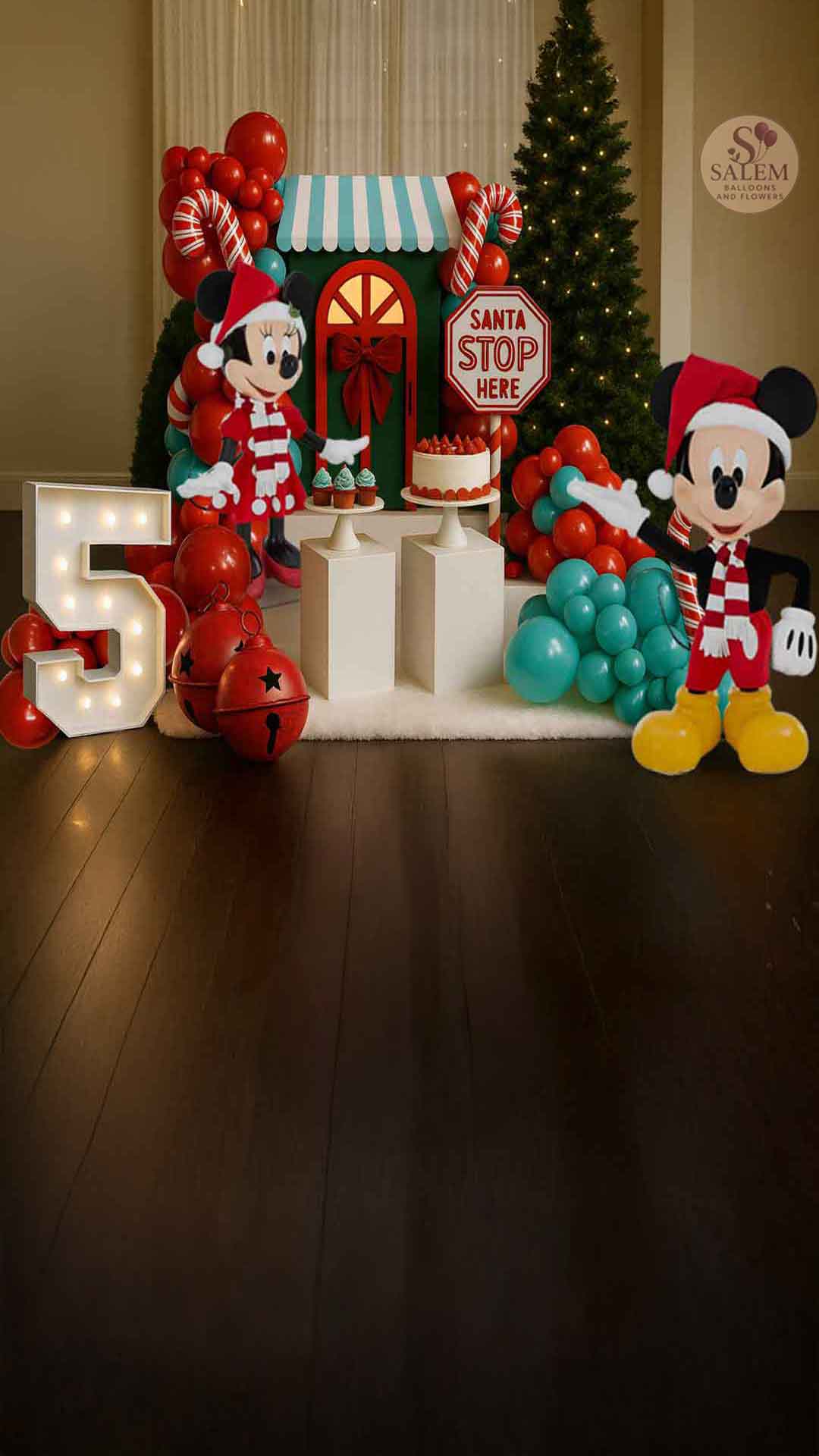 Decorative setup with balloon garlands, Mickey Mouse balloons and festive sculptures in a room with a Christmas tree. Balloon decor. Oregon.