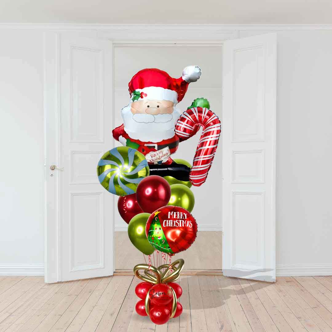 Santa Claus balloon waving as he holds a candy cane balloon among a set of helium balloons. Christmas Balloons Salem Oregon. Size chart. Approx.6ft tall