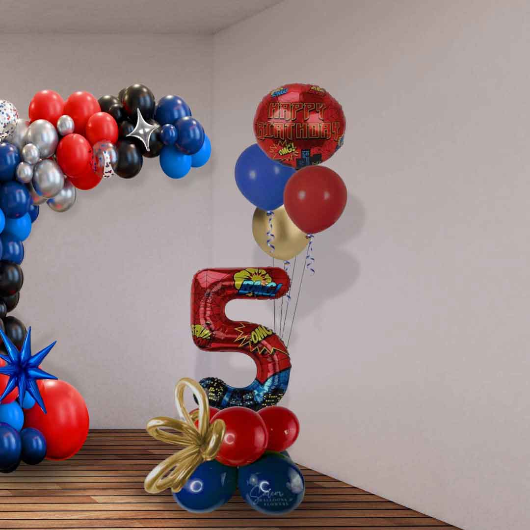 Colorful balloon arrangement with a spiderman themed number '5' and 'Happy Birthday Standing on a corner in a room decorated with a balloon garland. Oregon balloon delivery.