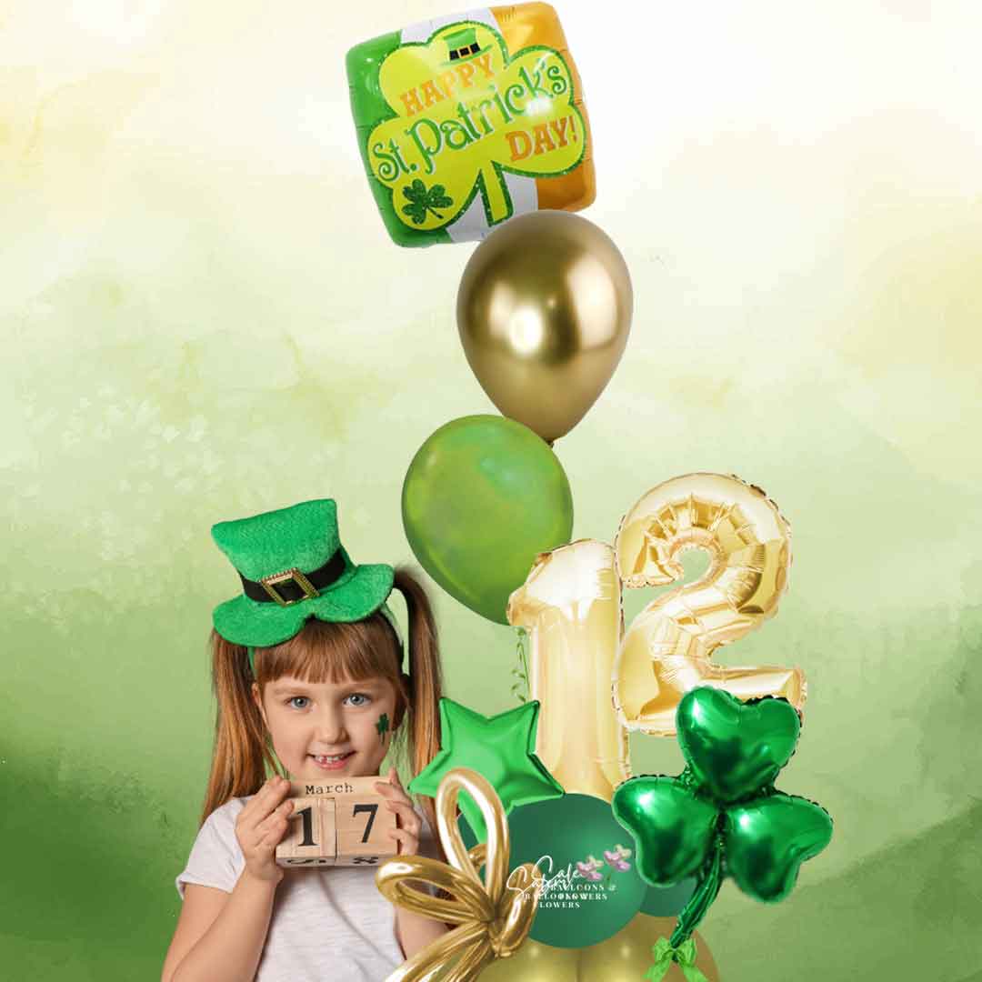 A little girl holding a St. Patrick's Day themed number balloon bouquet. Featuring a set of helium balloons with a "Happy St. Patrick's Day" message, 2 number balloons and a shamrock balloon. Balloon delivery Salem Oregon and nearby cities.