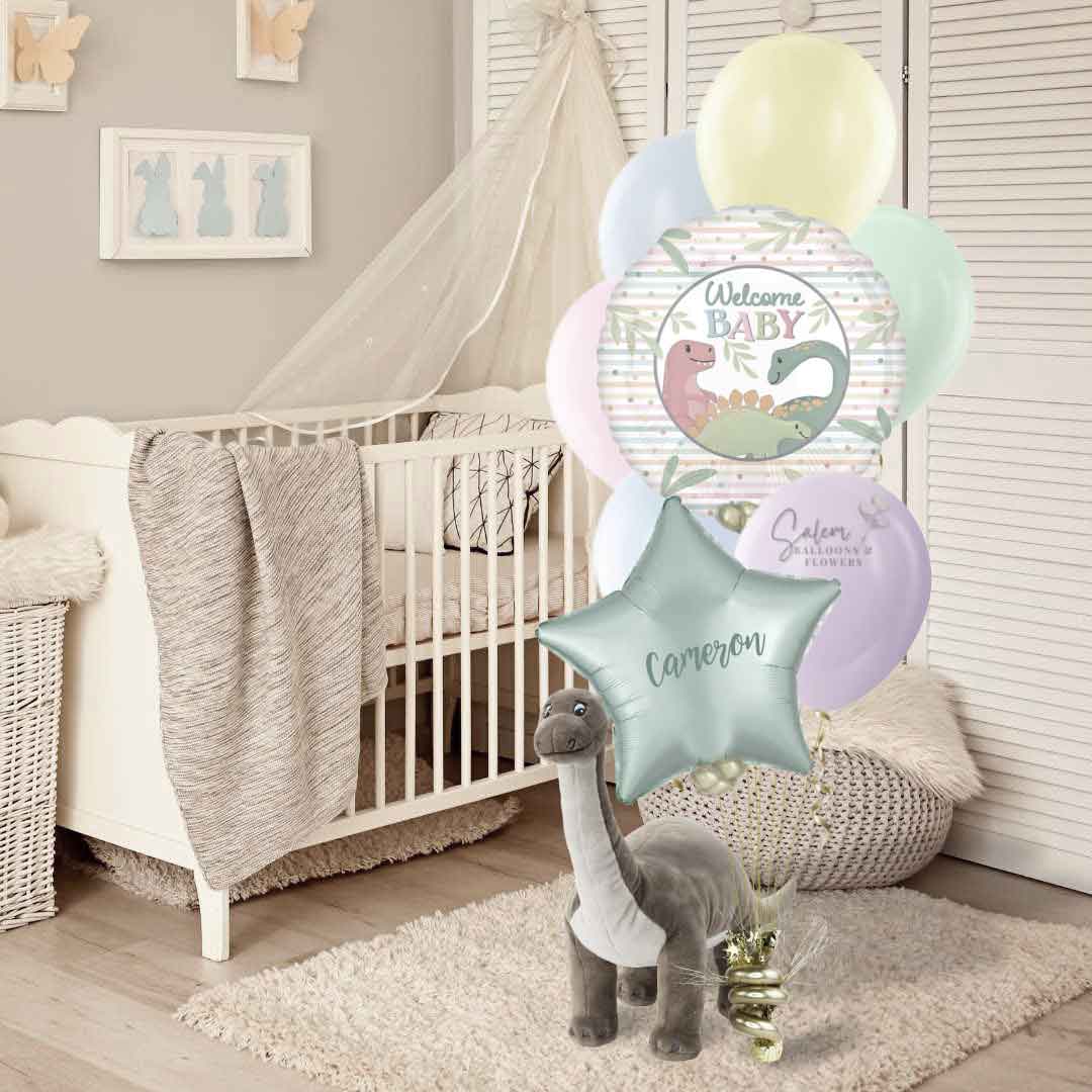 A nursery room with a "Welcome Baby" helium balloon bouquet, featuring a pastel colors mylar balloon, a pastel color star balloon,  and a set of pastel colors  latex balloons. Balloon delivery Salem Oregon and nearby cities.