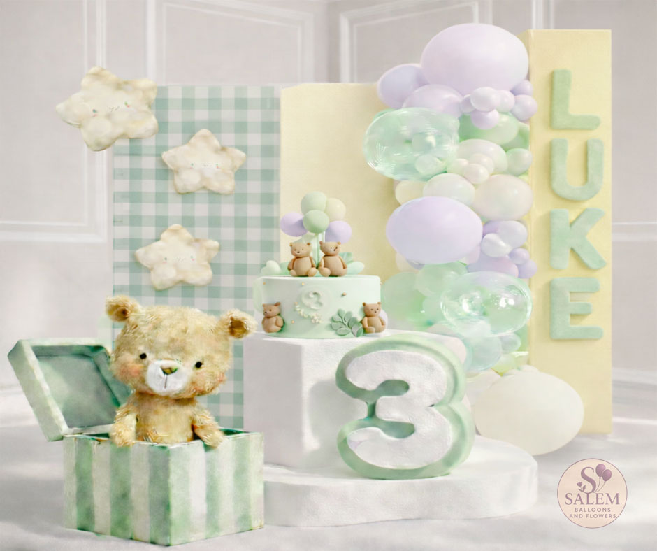 Children's birthday balloon decor setup with teddy bear, cake, and balloons in pastel colors. Balloon decor. Oregon.