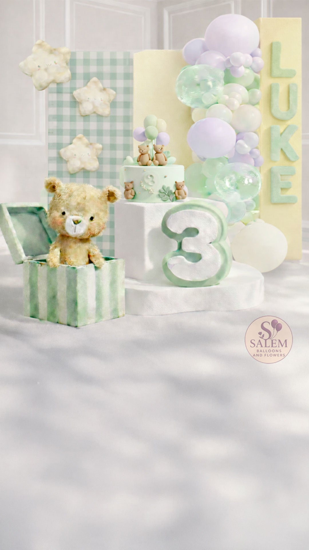 Children's birthday balloon decor setup with a teddy bear cutout, cake, and balloons in pastel colors. Balloon decor. Oregon.