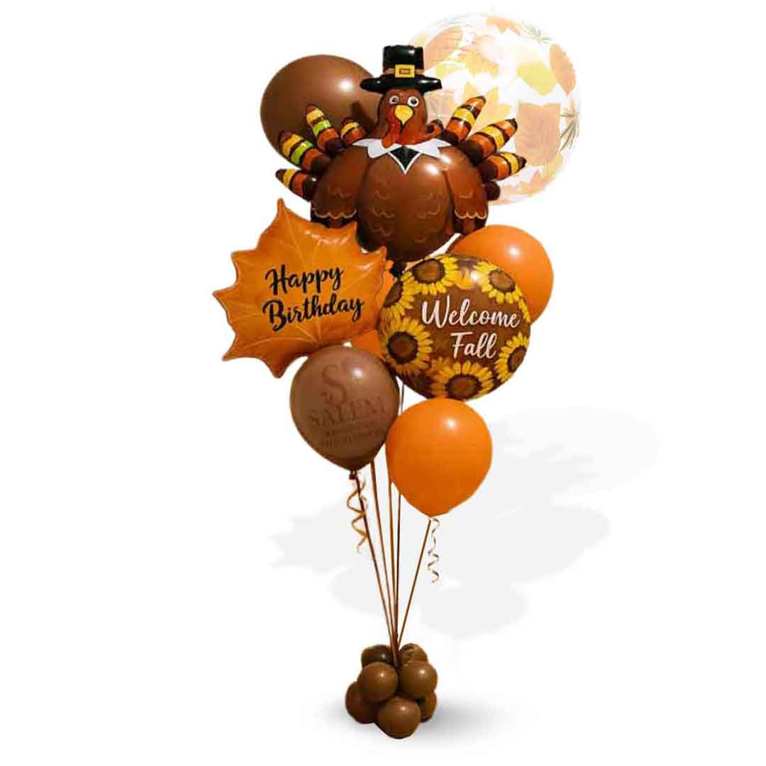 Balloon bouquet with Thanksgiving and fall-themed balloons on a white background. Salem OR balloon delivery.