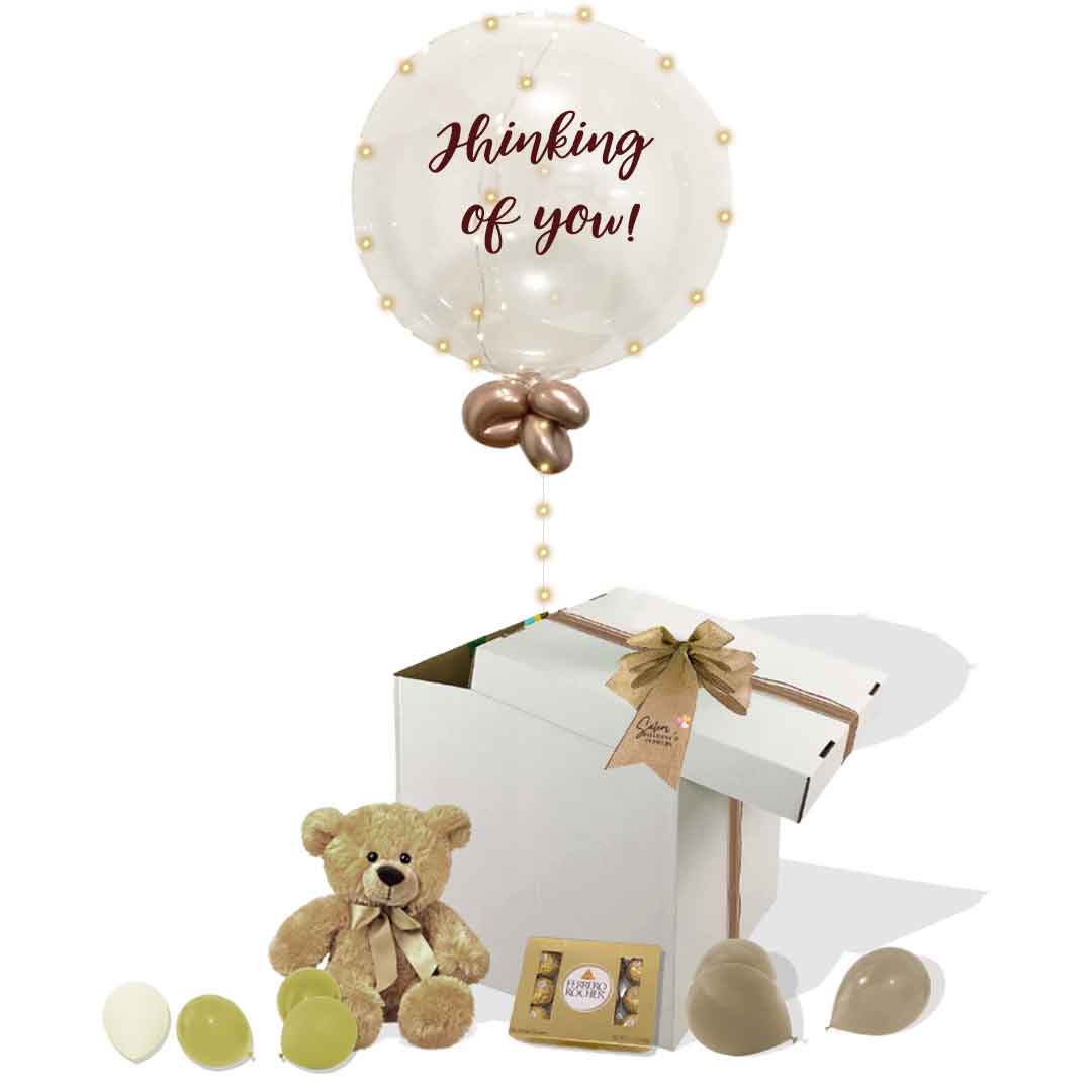 Thinking of you balloon box. Filled with a light-up bubble balloon with a "Thinking of You" message, a soft plush and chocolates. Delivery in Salem Oregon and nearby cities.