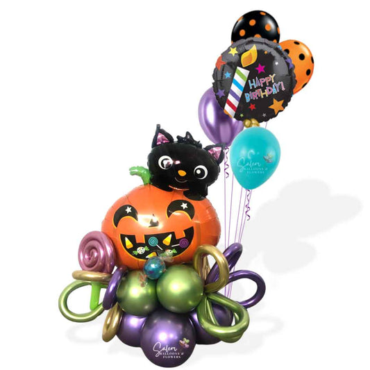 Halloween themed balloon bouquet, featuring a pumpkin balloon with a cute black cat, decorated with helium balloons and curly balloons. Oregon Balloon delivery.