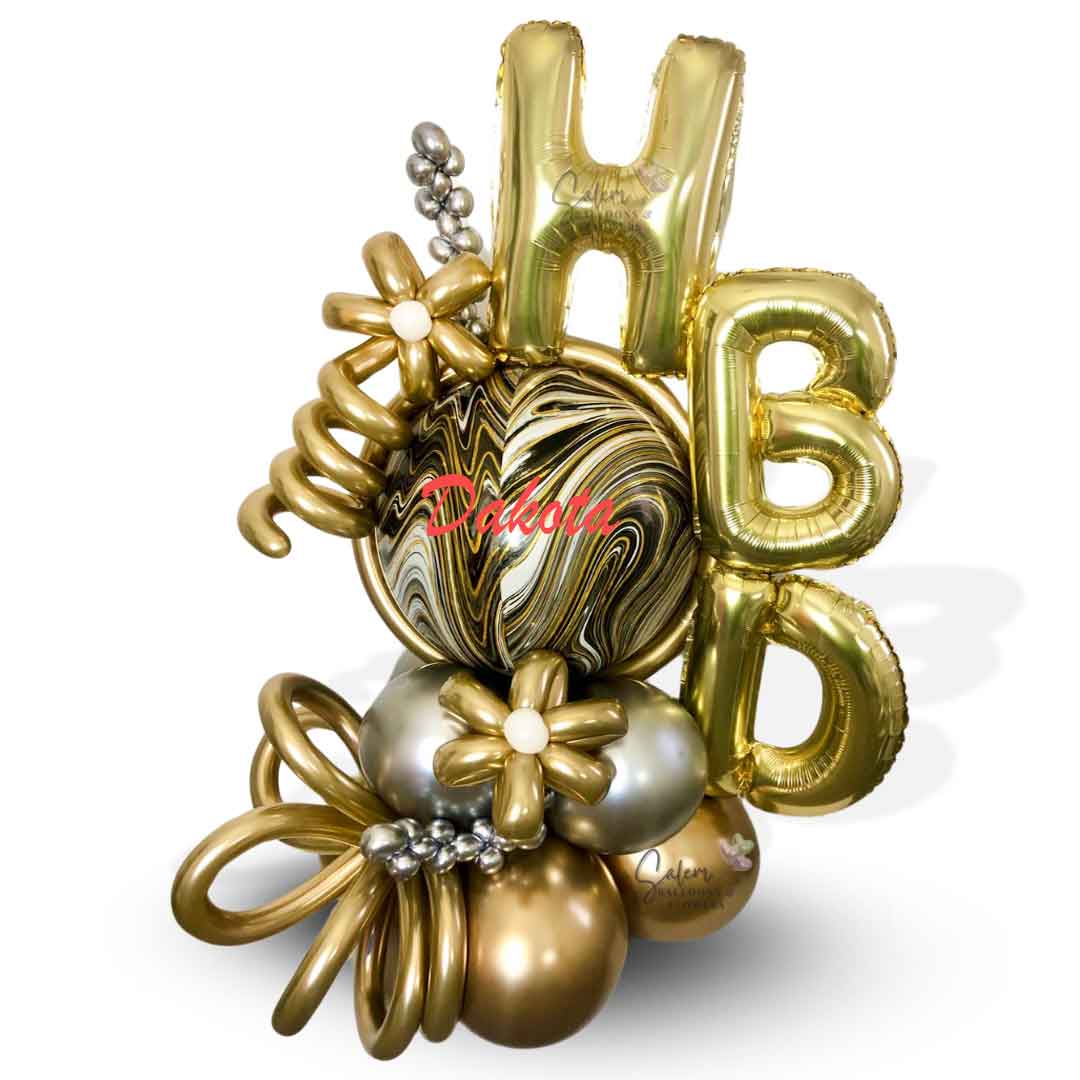 HBD Balloon bouquet. Luxury Balloon Arrangement. Featuring golden HBD letters, a marbled orbz balloon in gold, silver and black colors and decorated with golden flowers and curly balloons and personalized name. Oregon  Balloon Delivery.