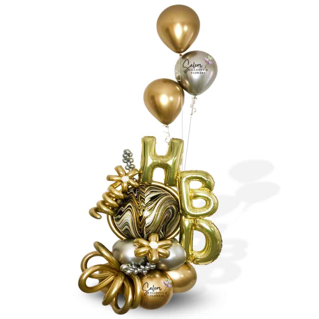 HBD Balloon bouquet. Luxury Balloon Arrangement. Featuring golden HBD letters, a marbled orbz balloon in gold, silver and black colors and decorated with golden flowers,curly balloons and a set of helium balloons in silver and gold. Oregon  Balloon Delivery.