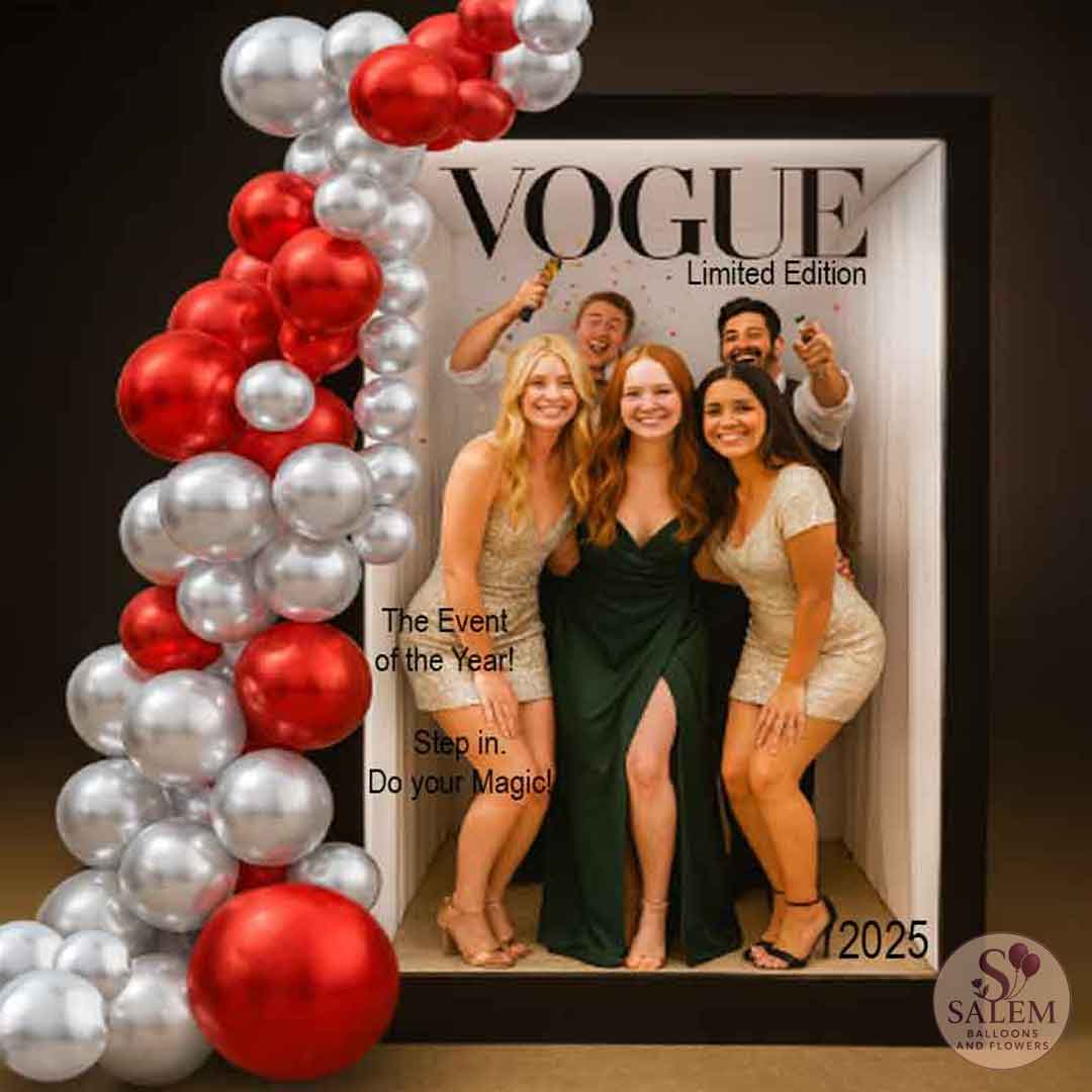 Decorative balloon garland in red and silver attached to a magazine cover photo booth with a group of young people posing for a picture from inside. Oregon party rentals.