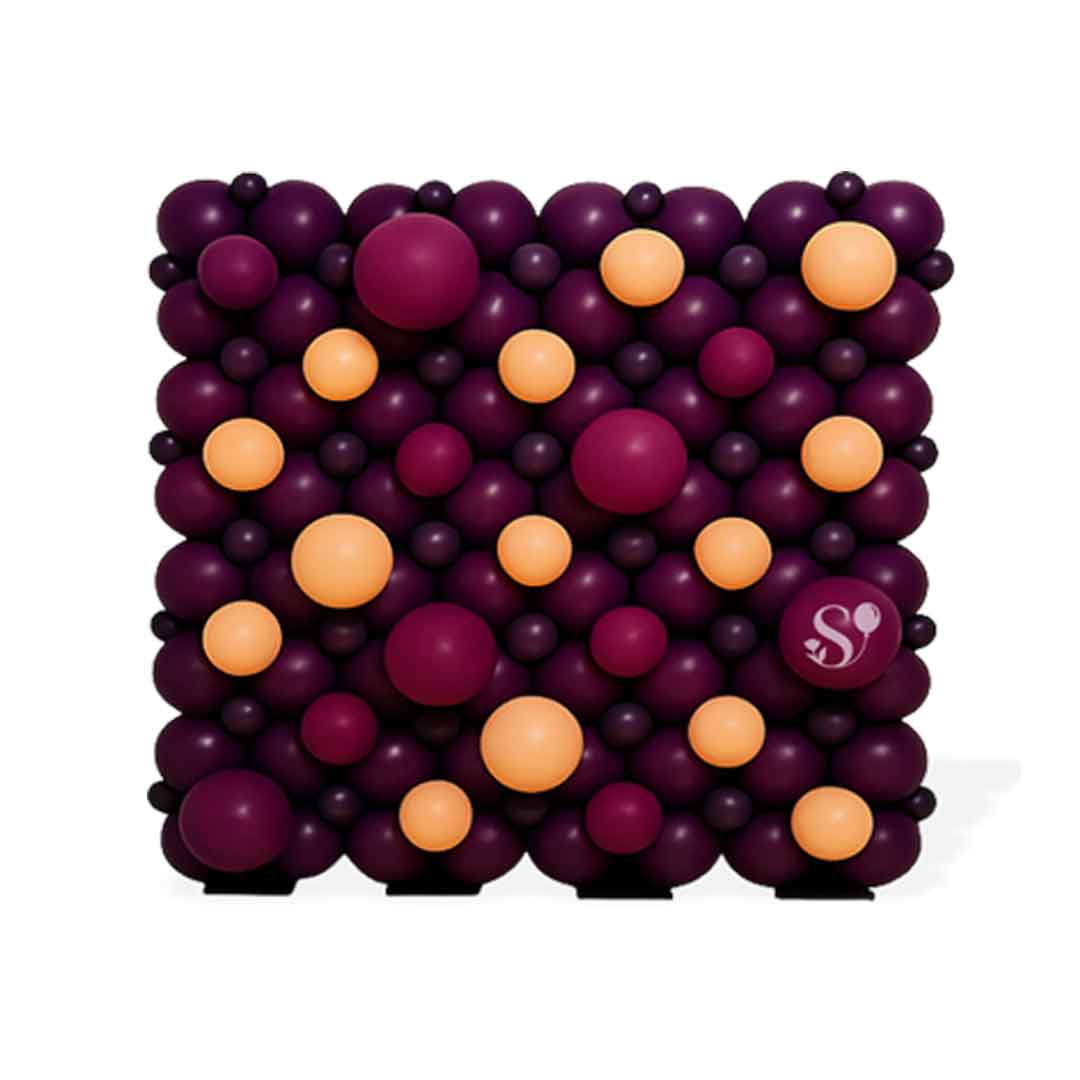 Square balloon wall in purple and orange balloons with a visible brand logo on a white background. Service available in ORegon