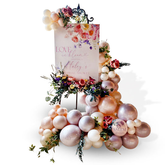Bridal shower welcome sign with luxury balloon garland and floral accents on a white background. By Salem Balloons and Flowers serving Salem Oregon and across the Willamette Valley Oregon