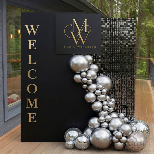 Decorative entrance with 'Welcome' sign, silver balloons, and branding. Corporate balloon decor for events. Oregon