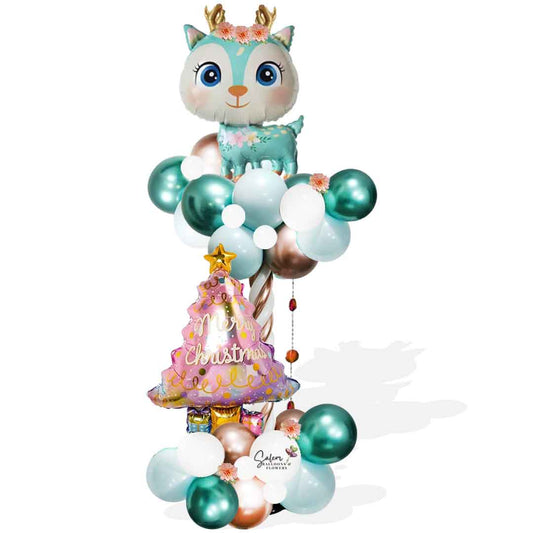 Christmas Balloon column featuring a Reindeer in pastel colors and a Christmas tree Balloon. Christmas balloons Salem Oregon 