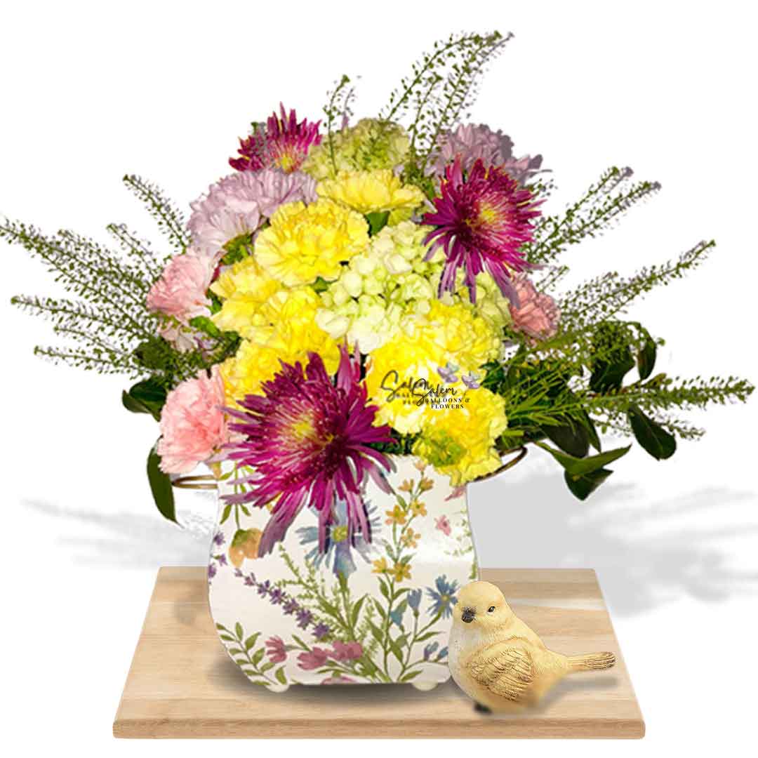 Fresh flowers arranged in a square flower vase in pastel colors and decorated with a bird figurine. Salem Oregon Flower delivery