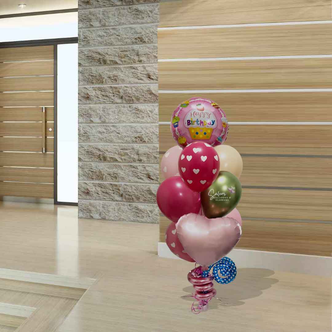 A cupcake themed helium filled balloon bouquet in pink and green colors. Birthday balloon delivery Salem Oregon and nearby cities. Size chart approx 4ft tall.