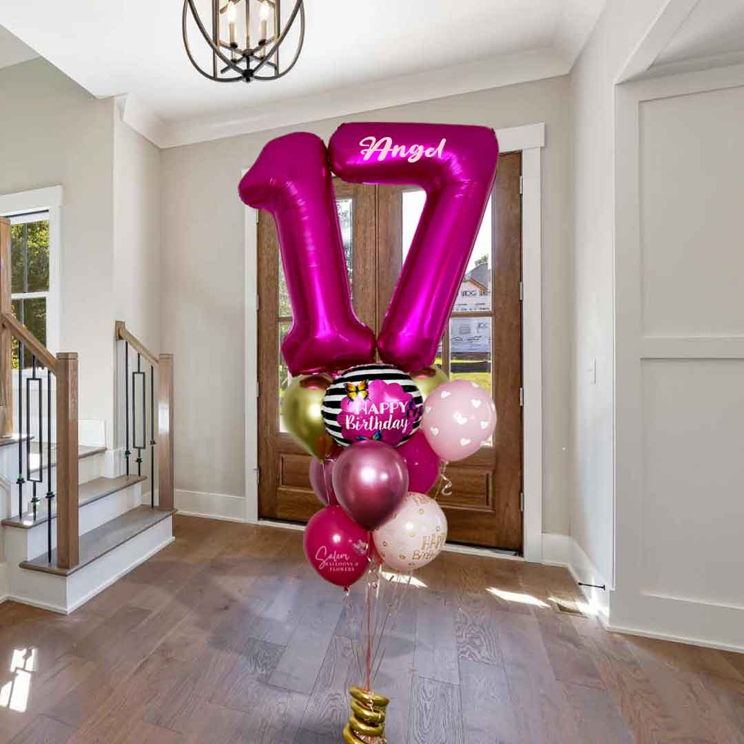 A Bouquet of balloons with a large pink number '17' balloon standing in an entryway, featuring a butterfly Happy Birthday Balloon.Balloon delivery. Oregon