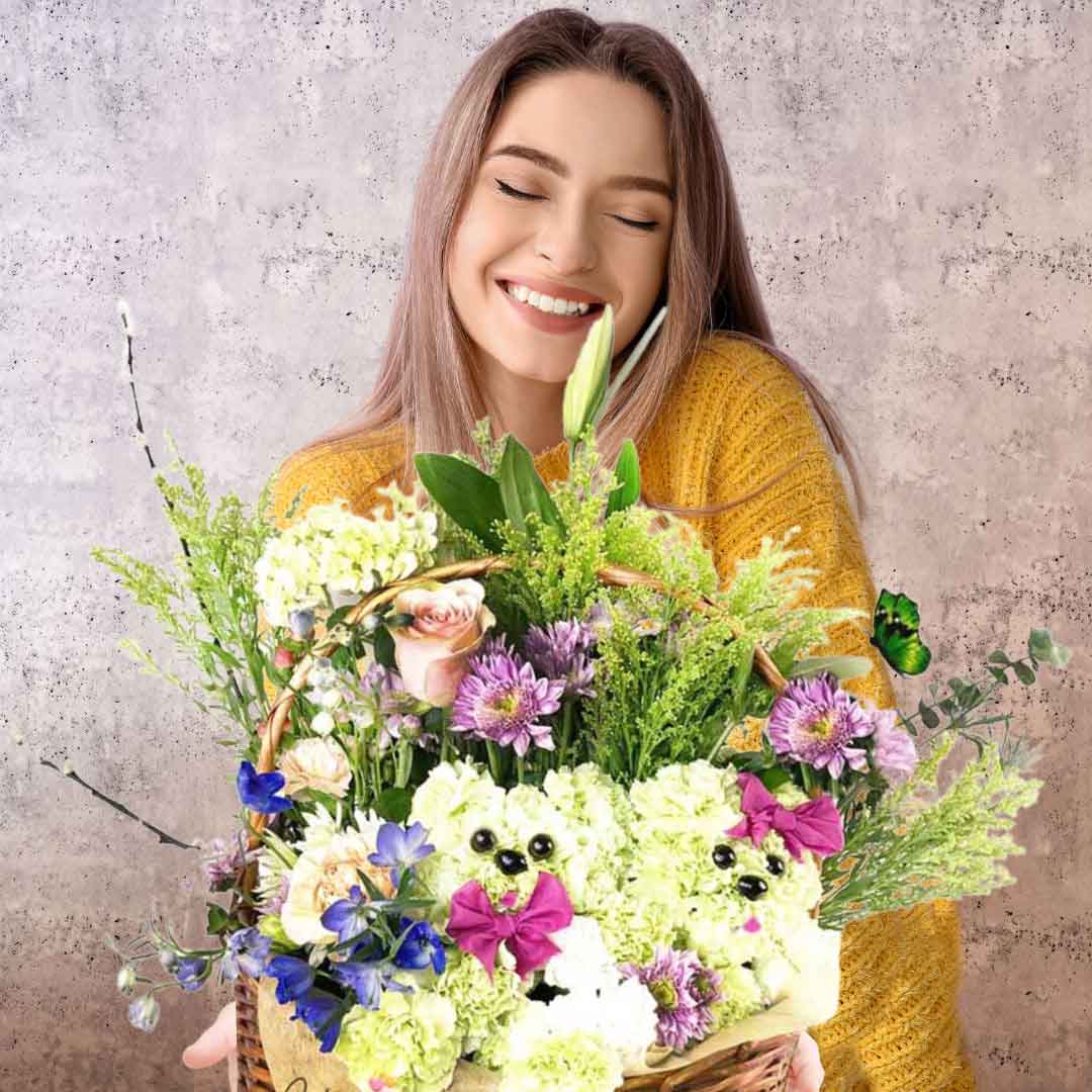 A girl holding a Basket flower arrangement. Featuring flower puppies poking out through the fresh beautiful flowers in a handcrafted basket. Awakening smiles and tender wiggles is easy with this playful Puppy Basket arrangement. A thoughtful gift for your favorite animal-lover! Free Delivery available in Salem Oregon and nearby areas.
