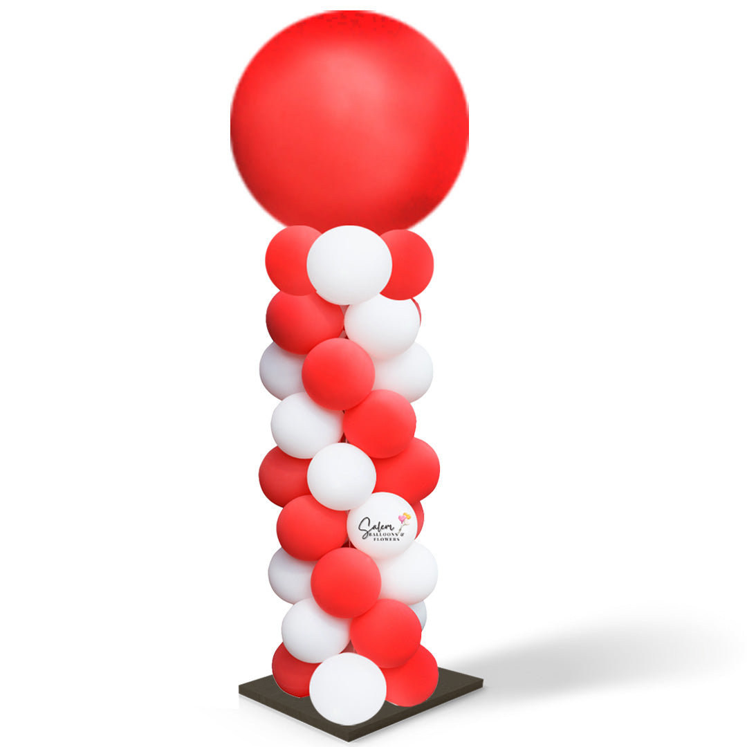 balloon column in red and white with a red round topper. Salem Oregon balloon decor.