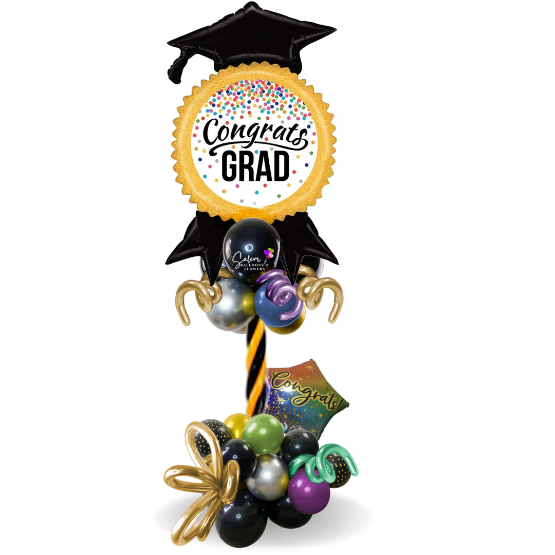 Congrats Grad! Extra tall Balloon Column. Featuring an extra-large Mylar balloon with a Congrats Grad message. An amazing gift, that doubles as a prop to take memorable pictures. We offer delivery in Salem Oregon and nearby cities.