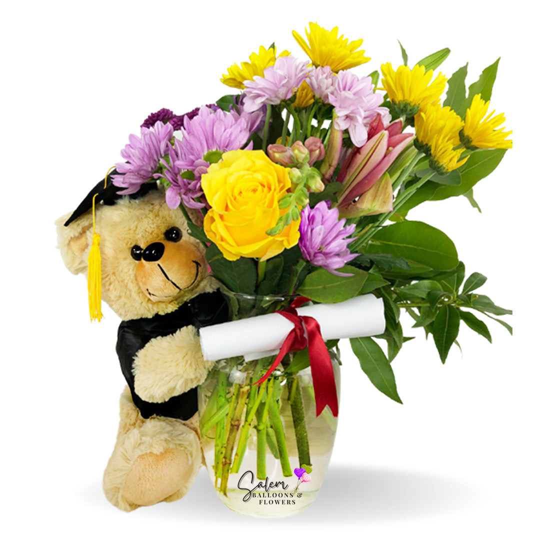 Graduation gift. Congrats flower arrangement with a teddy bear plush holding flowers. Delivery in Salem Oregon and nearby cities.