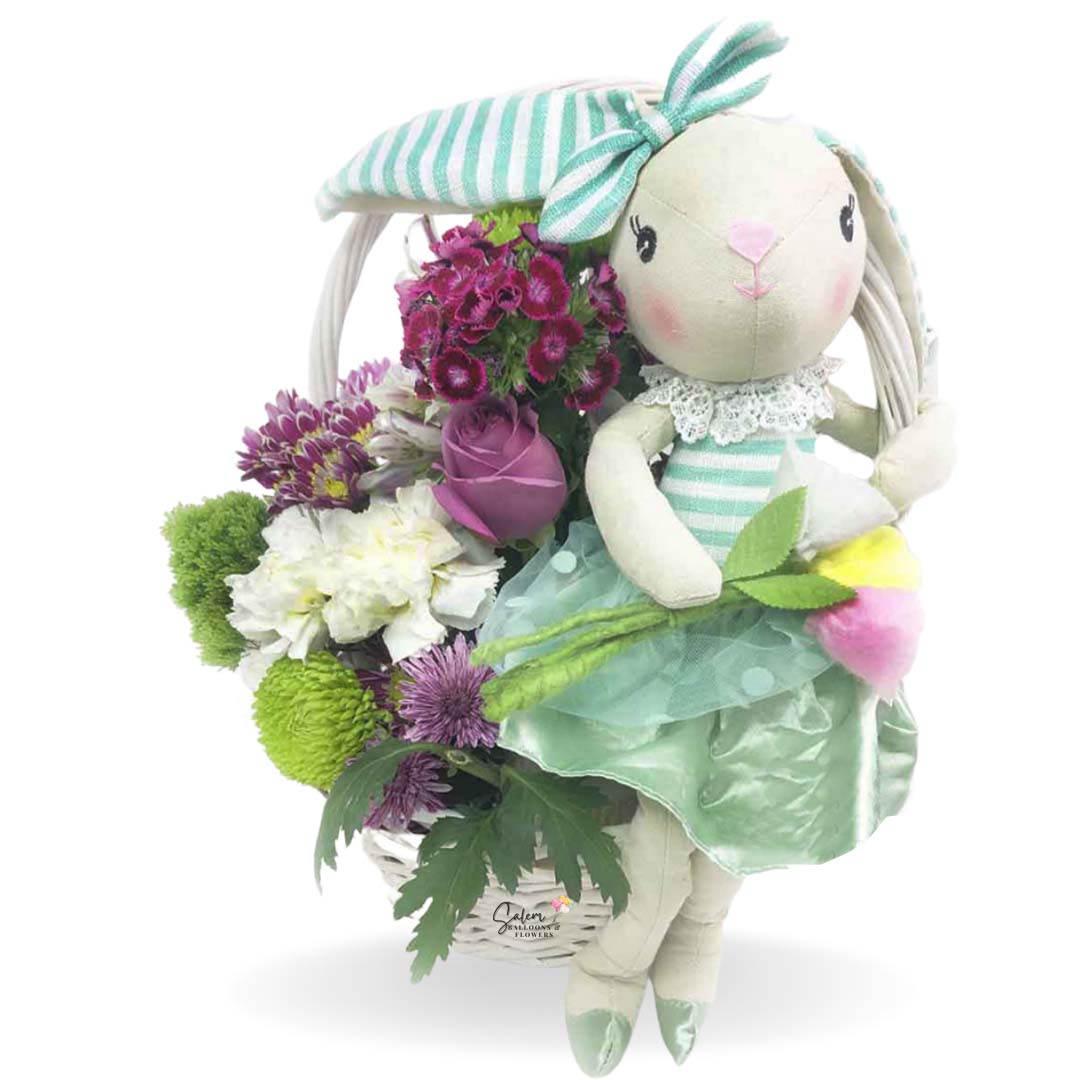 a flower basket with a bunny doll in a mint dress. Salem Oregon Flower delivery.