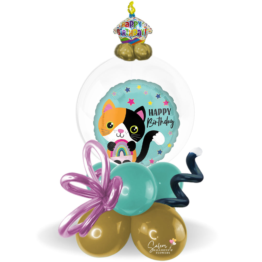 Stuffed bubble balloon arrangement. Featuring a Kitty cat themed Mylar balloon with a "Happy Birthday" message stuffed in a bubble balloon. Salem Oregon balloon delivery.