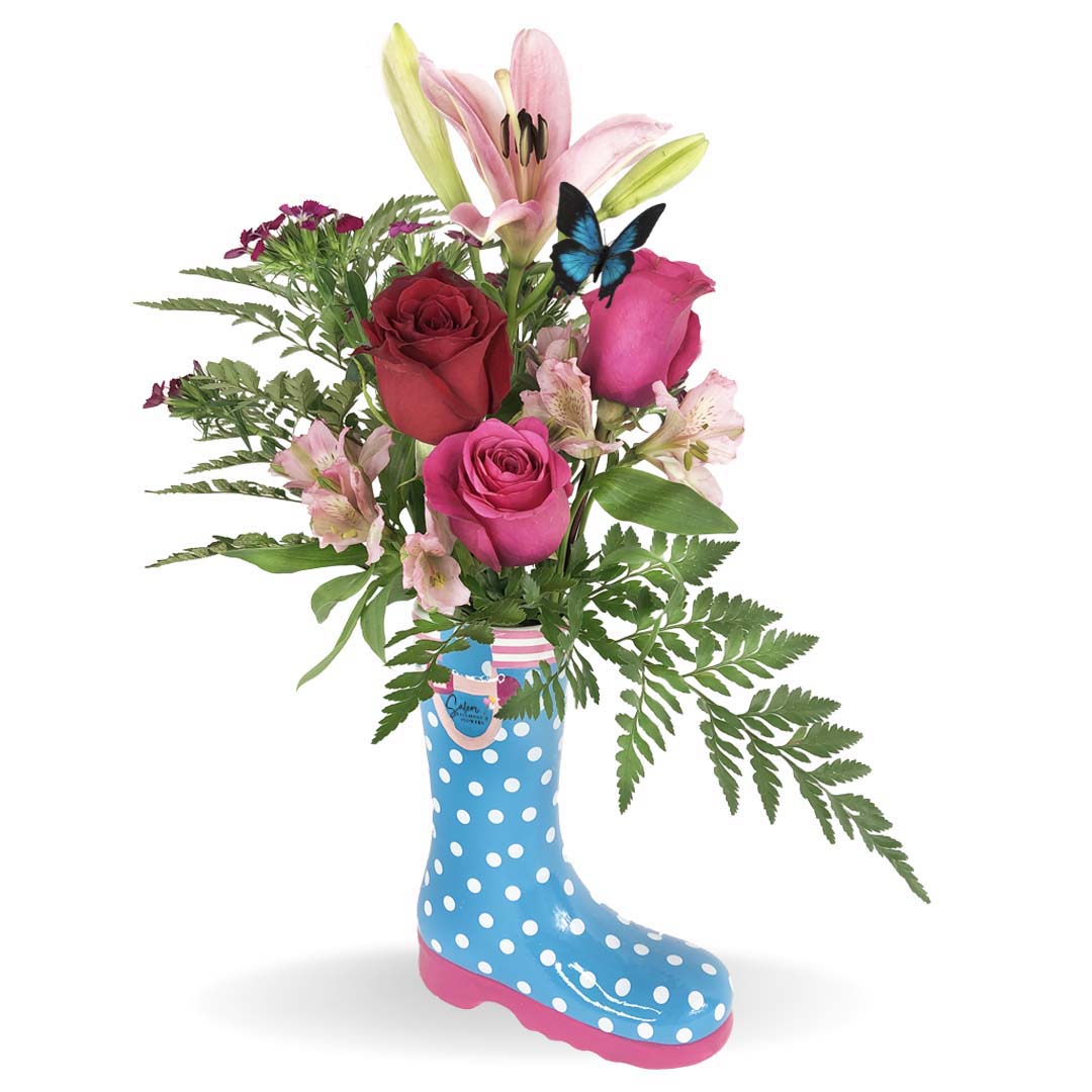 Colorful and amused flower bouquet. Featuring a cute polka-dots boot shaped ceramic  vase. Available in pink, blue and green. Free delivery in Salem Oregon and nearby areas. 