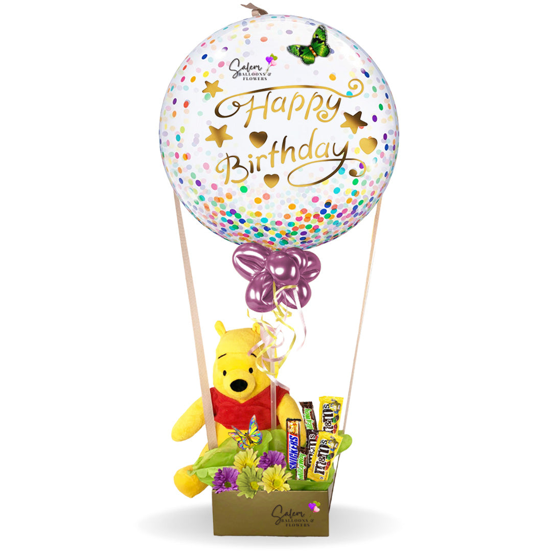 Happy birthday confetti bubble balloon gift. Featuring an adorable Pooh plush riding a hot air shaped balloon arrangement full of chocolates. Balloon delivery in Salem Oregon and nearby cities.