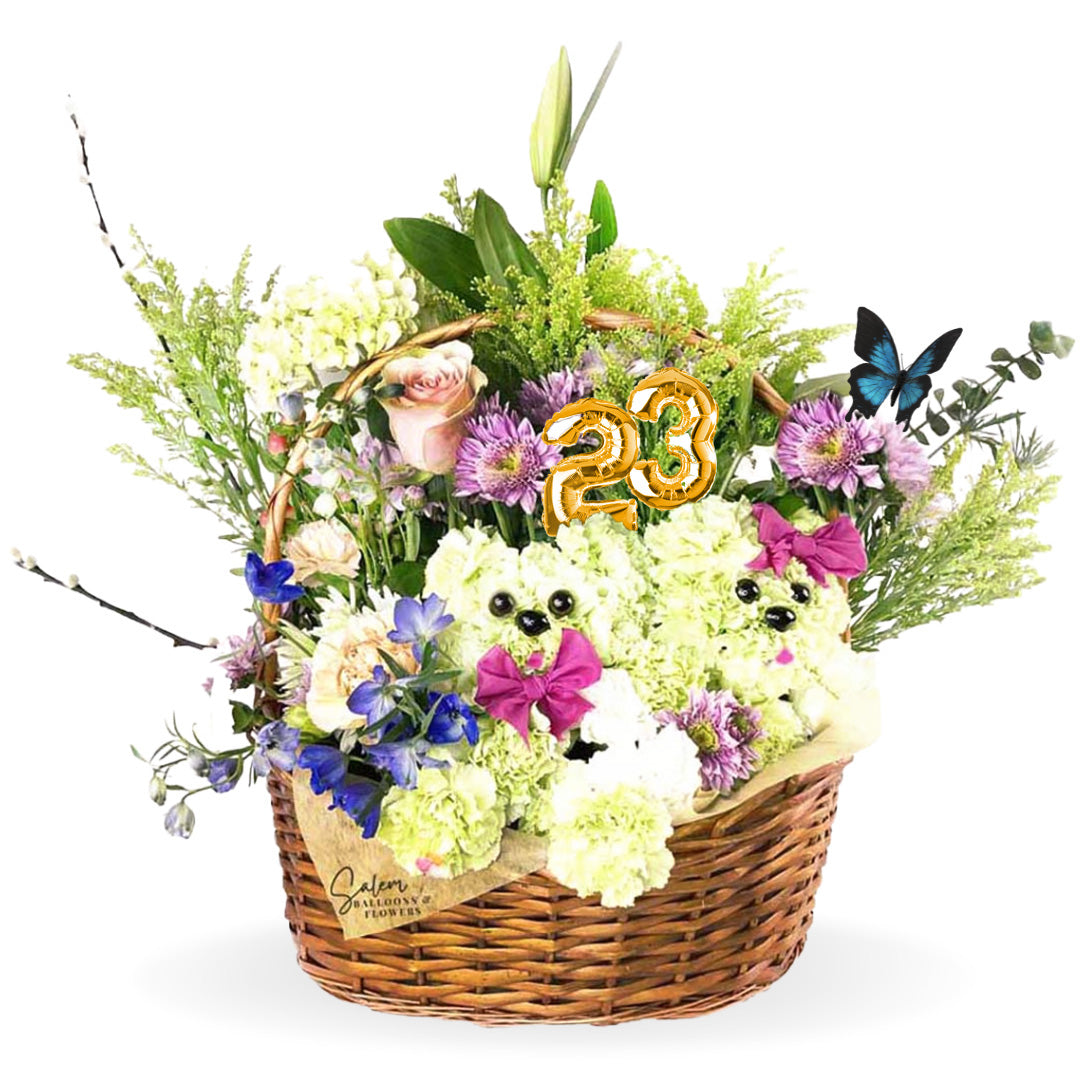 Basket flower arrangement. Featuring flower puppies poking out through the fresh beautiful flowers in a handcrafted basket. Awakening smiles and tender wiggles is easy with this playful Puppy Basket arrangement. A thoughtful gift for your favorite animal-lover! Free Delivery available in Salem Oregon and nearby areas.